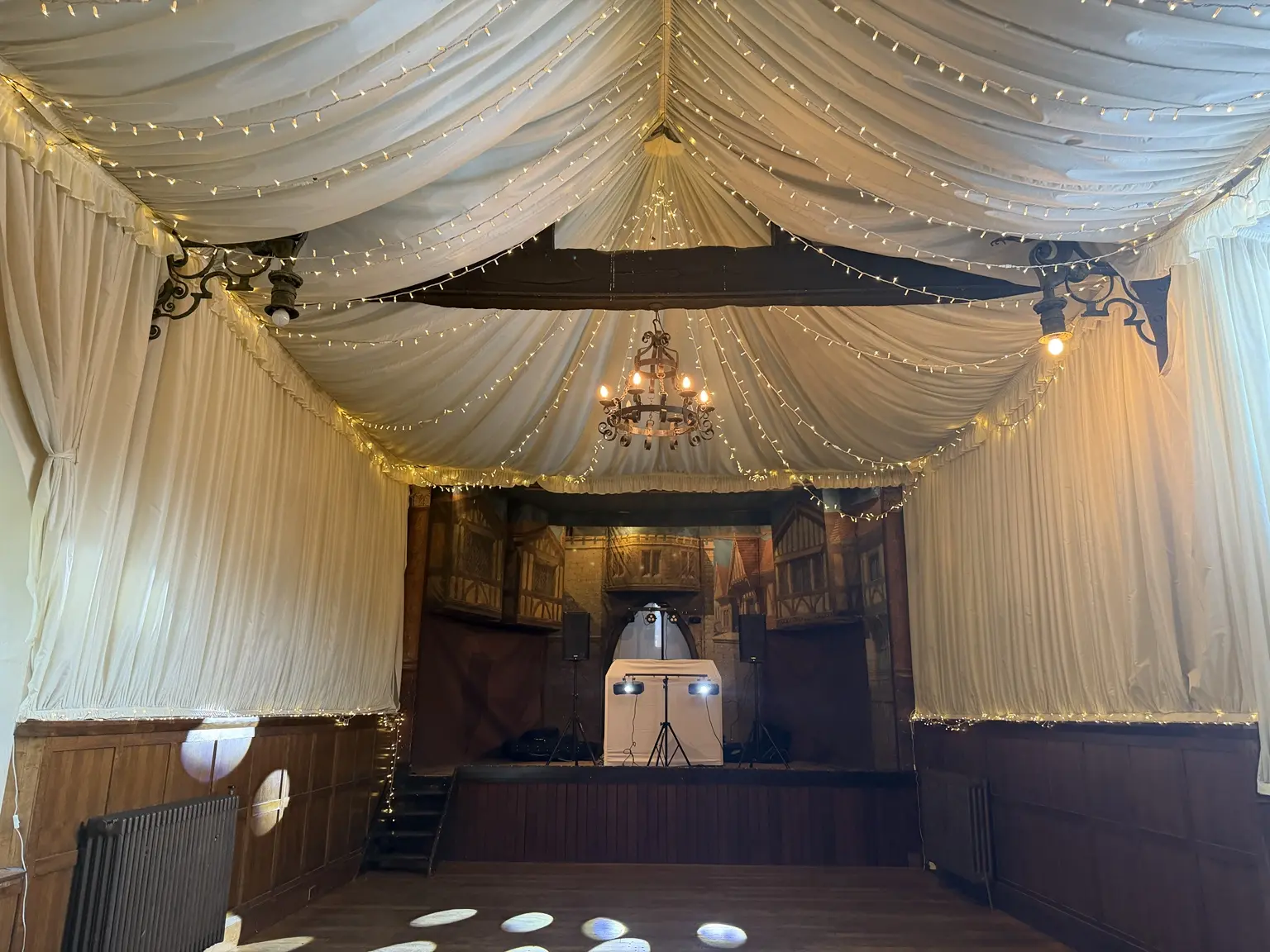 Hurricane Roadshow white DJ stand, speakers and lighting at How Caple Court